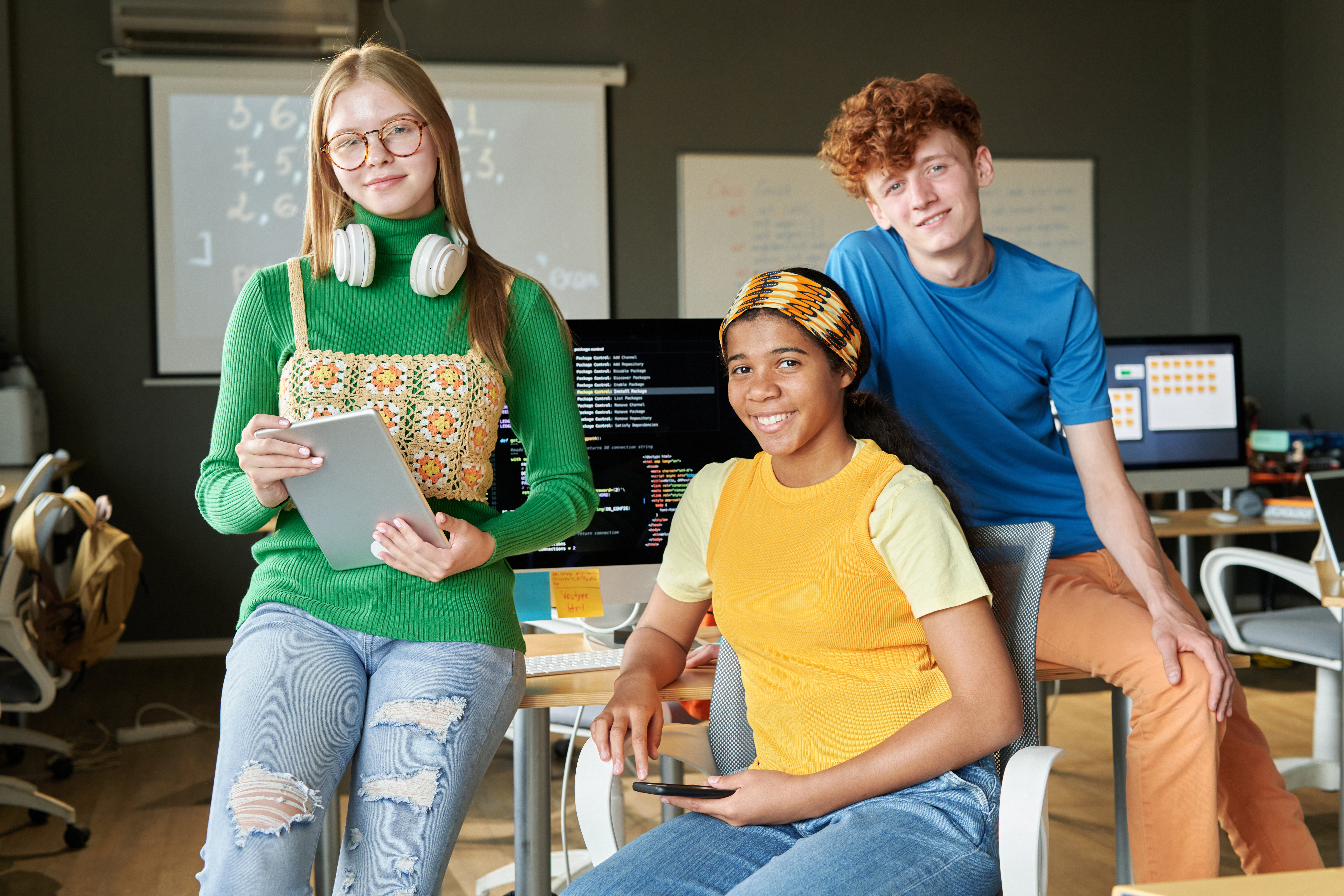 Group smiling in IT classroom